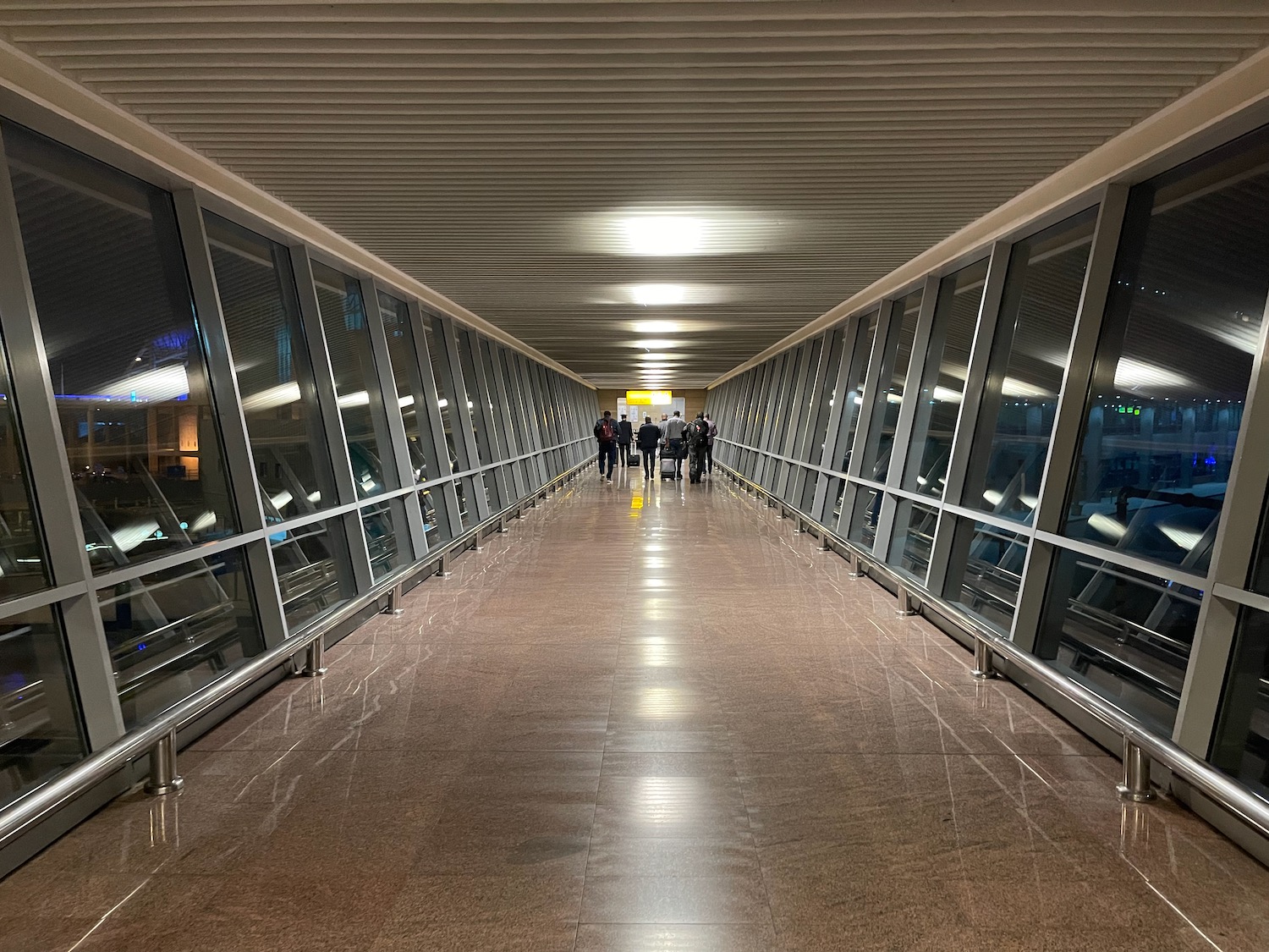 a group of people walking in a hallway