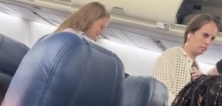 Seatmate Stands Up After Landing