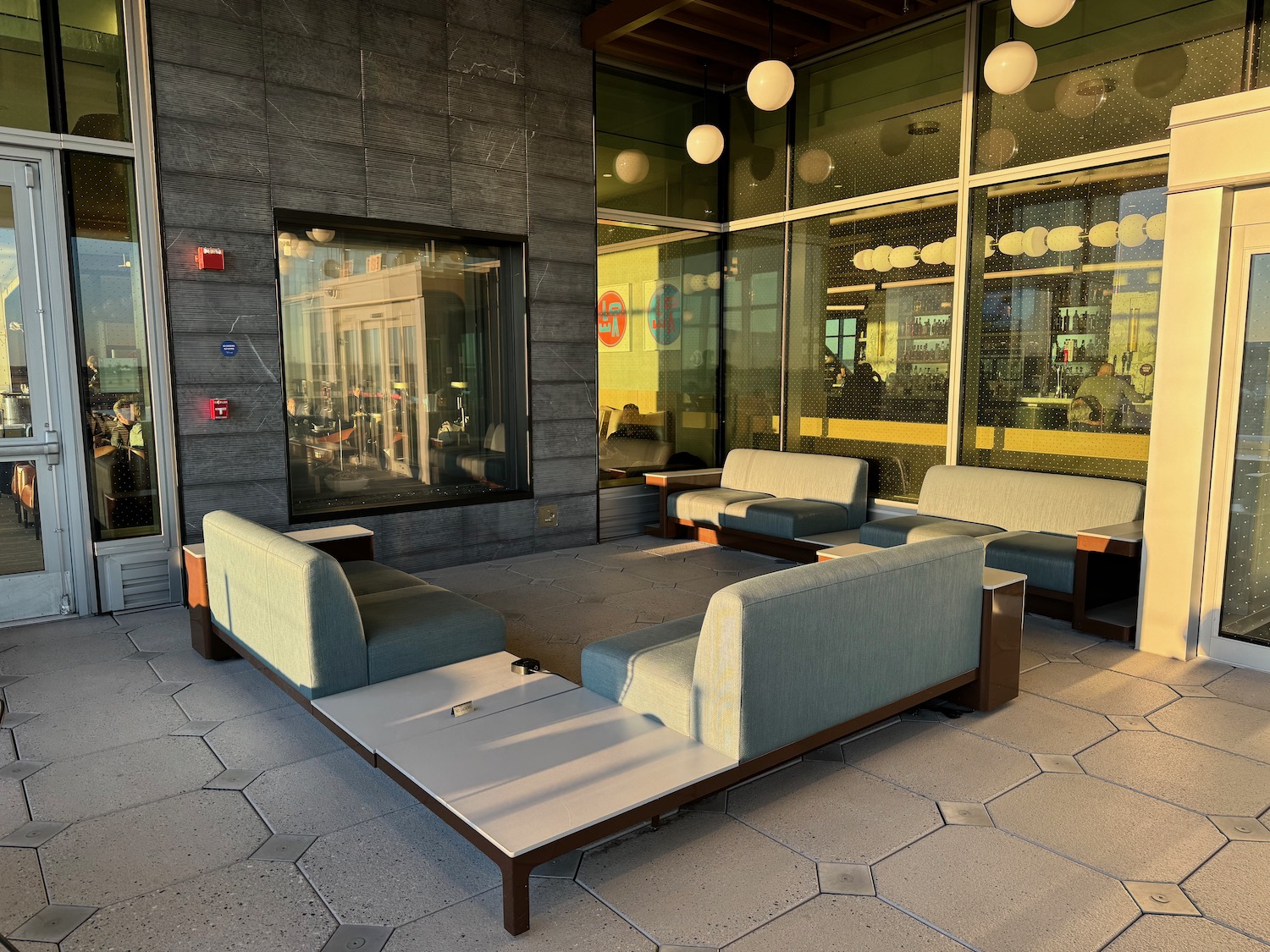 a couches and tables outside a building