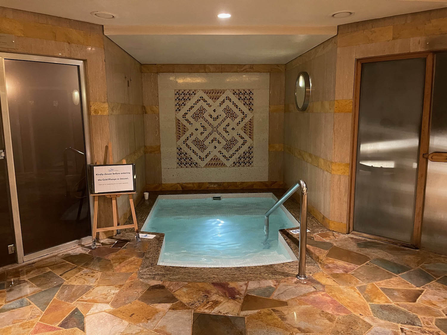 a indoor pool with a metal railing