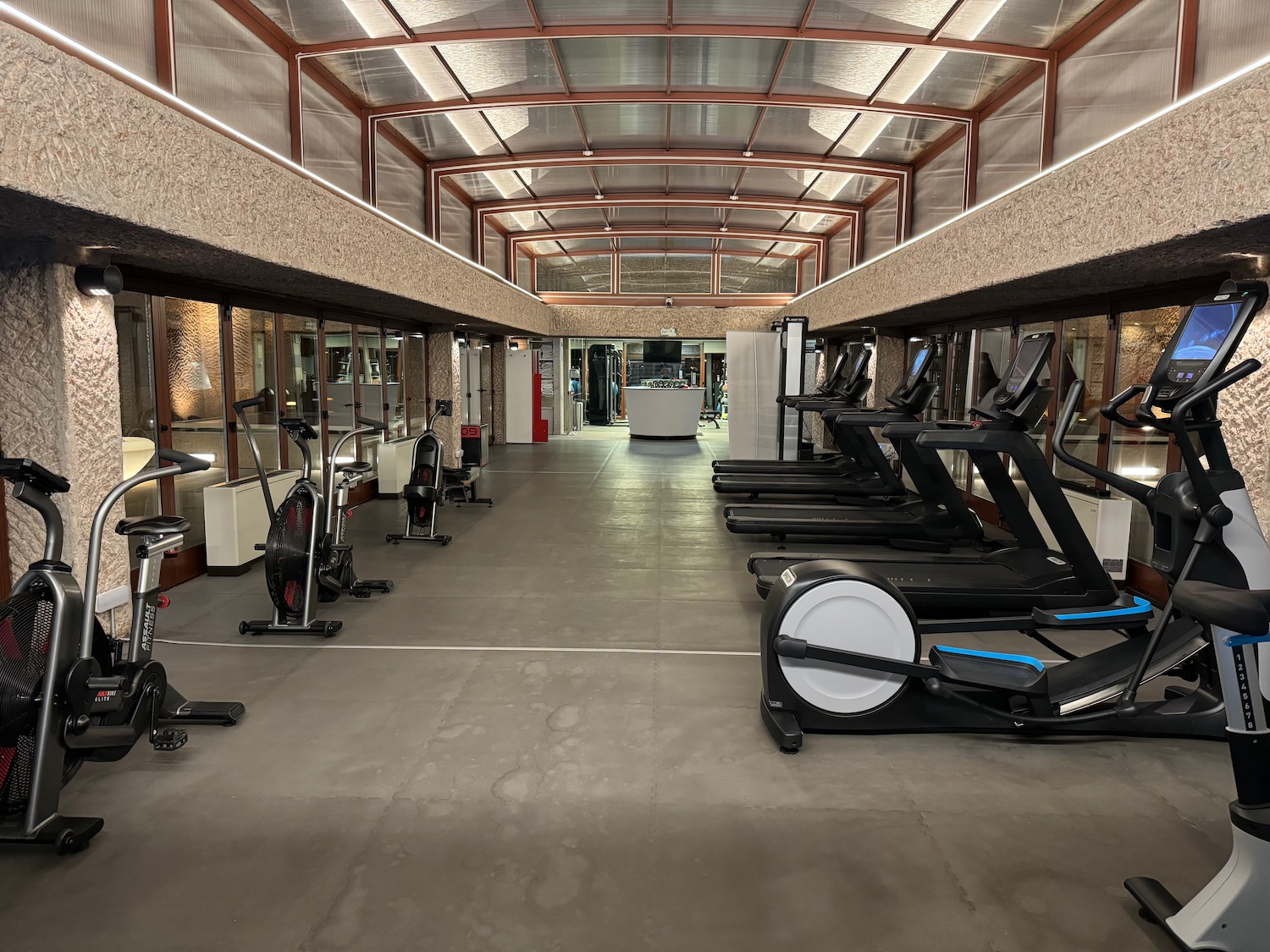 a gym with treadmills and exercise equipment