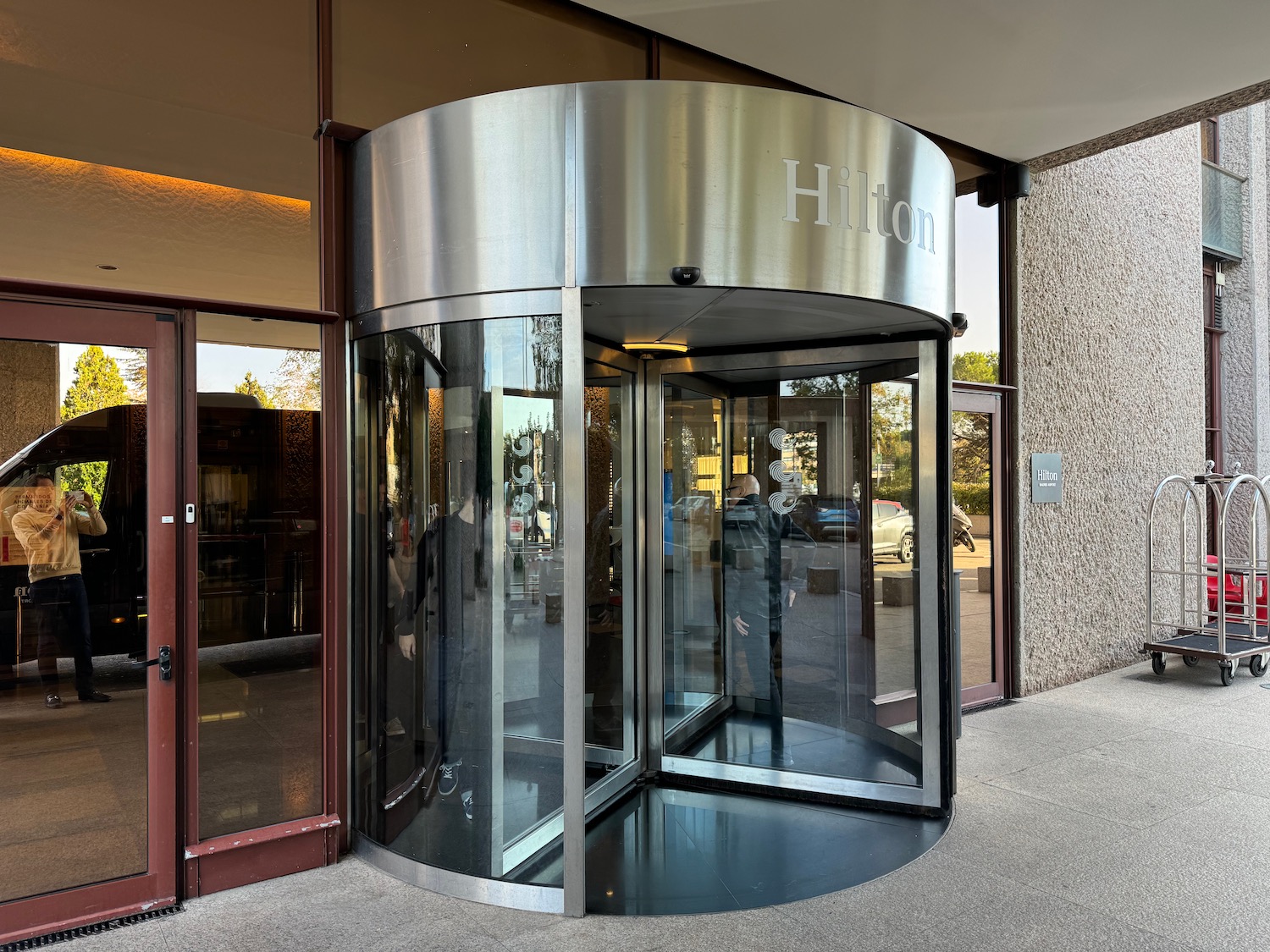 a glass door with a sign on the front of a building