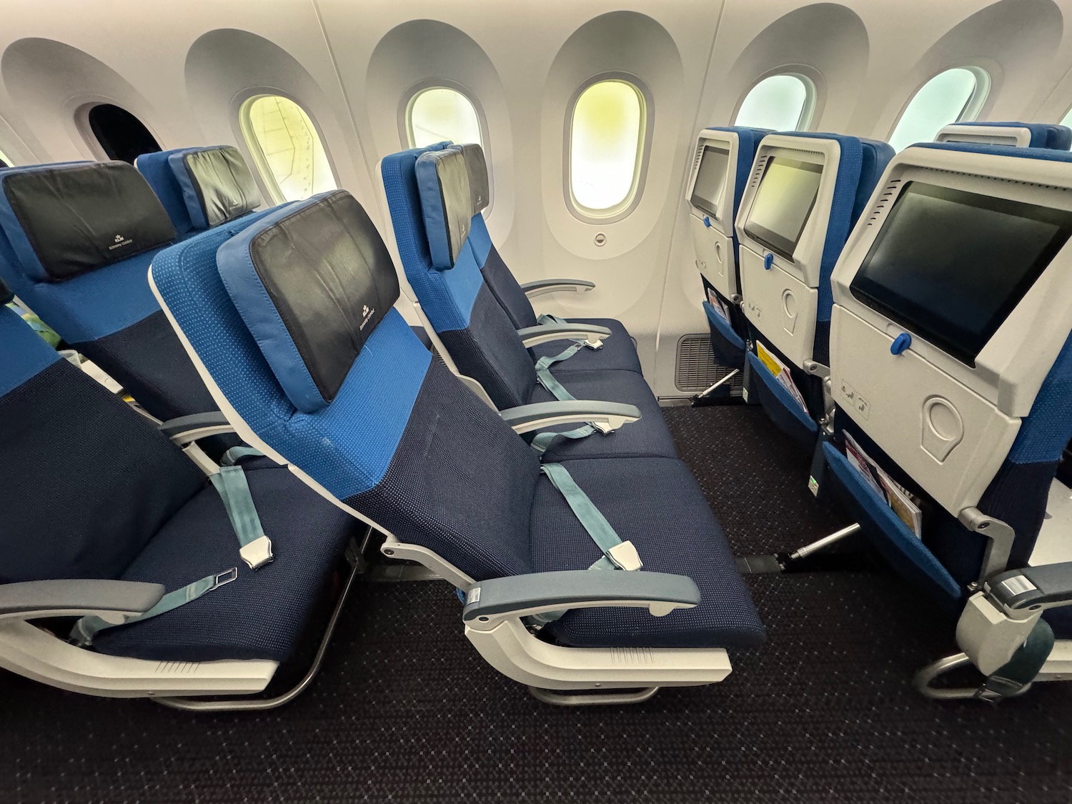 seats in an airplane with windows