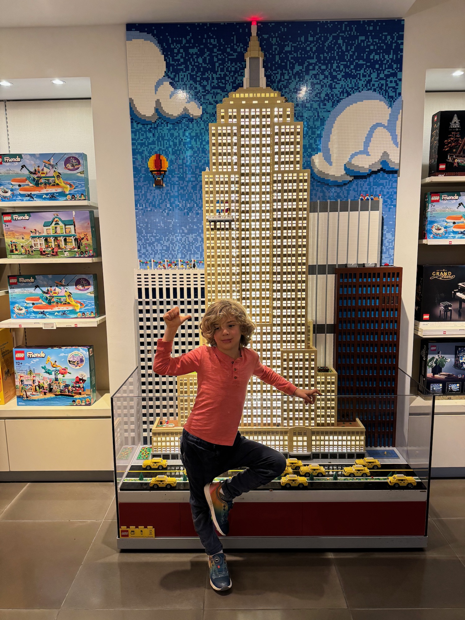 a girl posing in front of a building