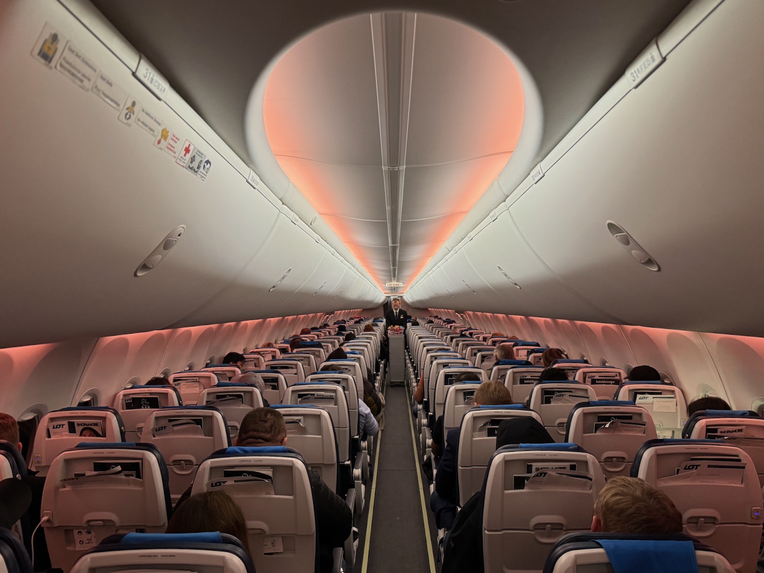 a plane with people sitting in the seats