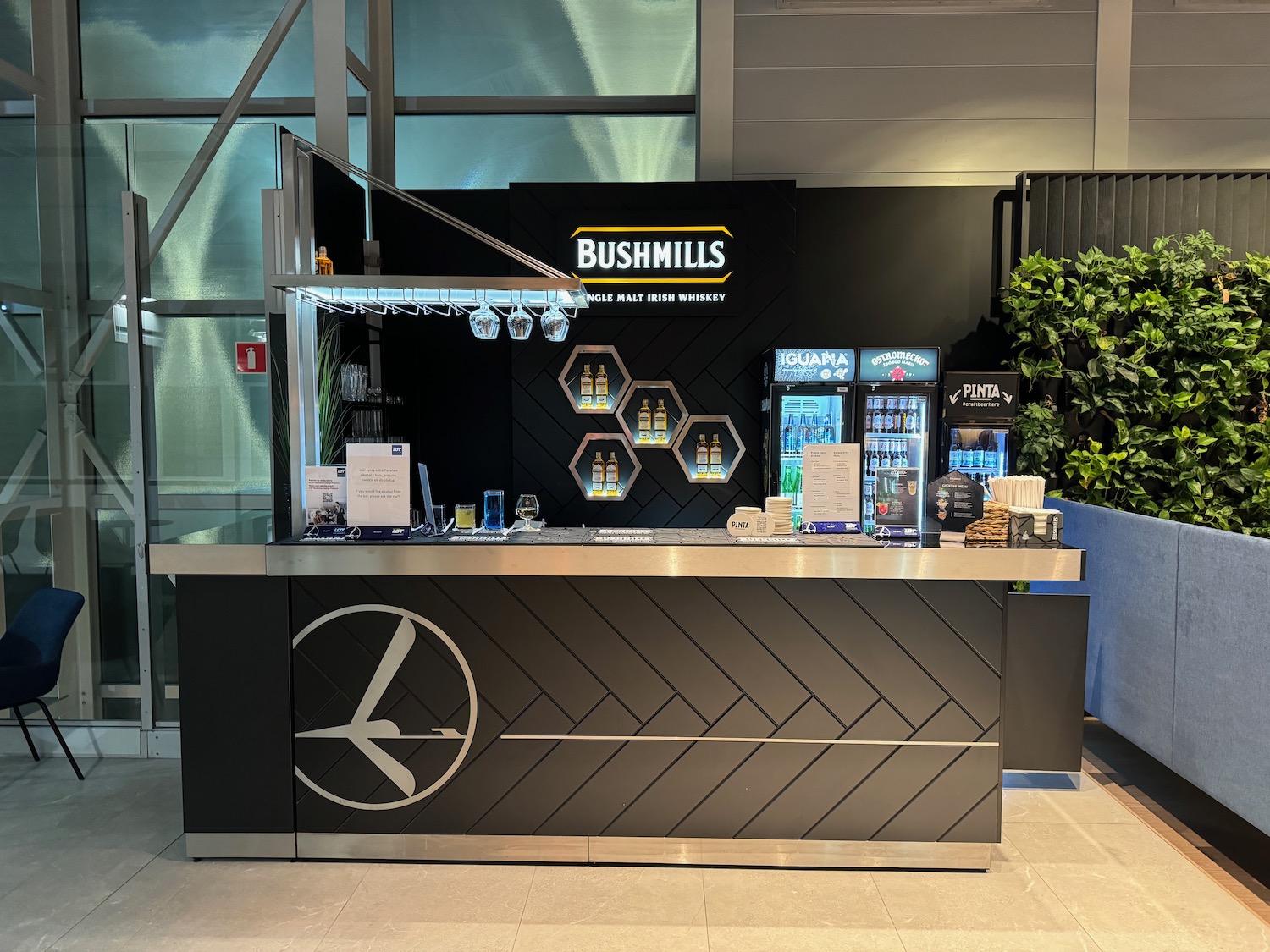 a counter with drinks and vending machines in a building