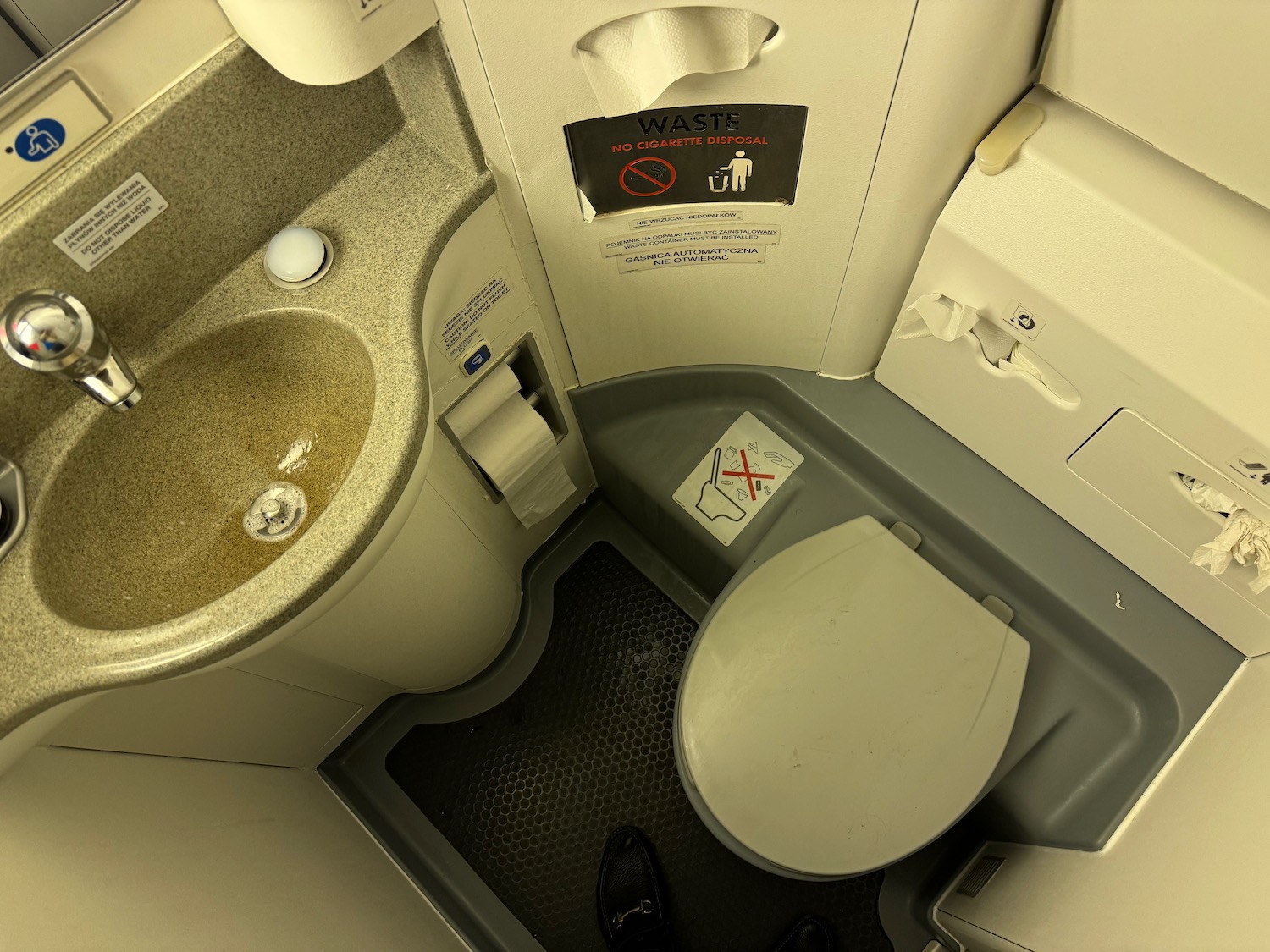 a toilet and sink in a plane