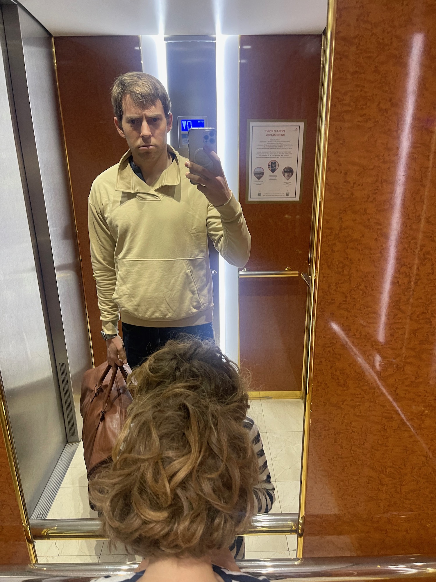 a man taking a selfie in a mirror