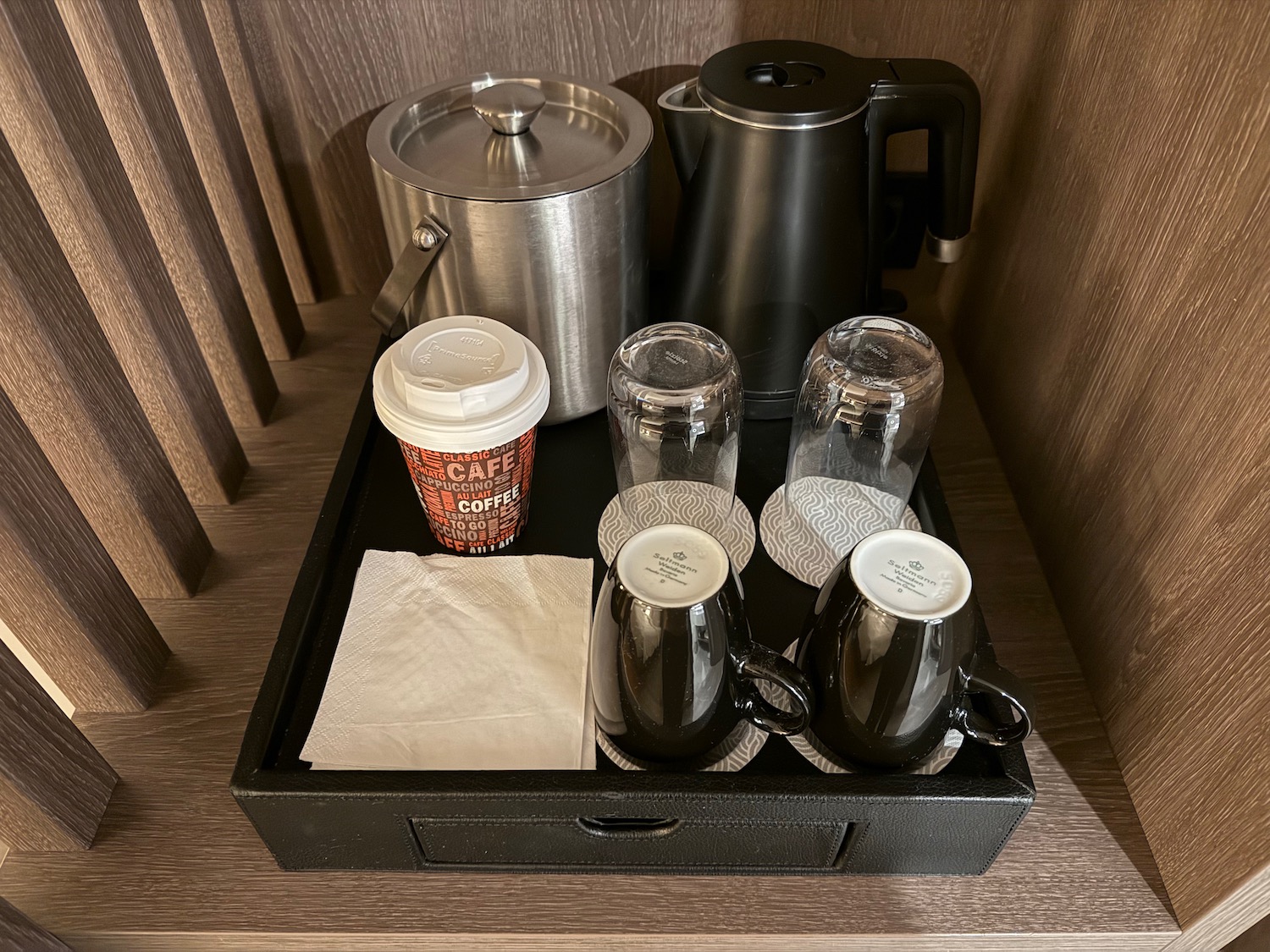 a tray of coffee and tea cups