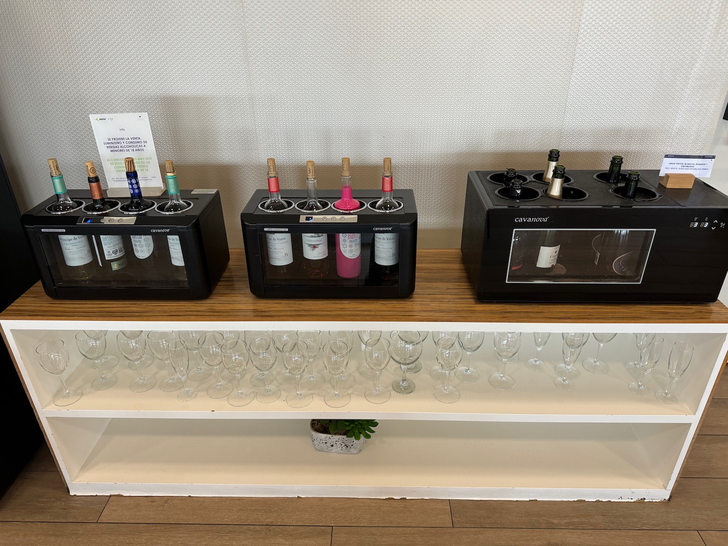 a group of wine bottles on a shelf