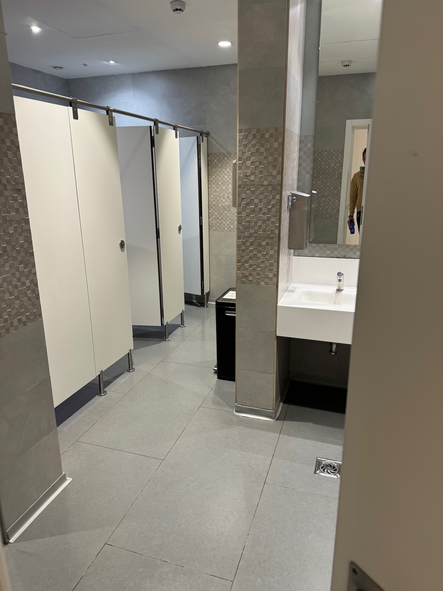 a bathroom with a sink and mirror