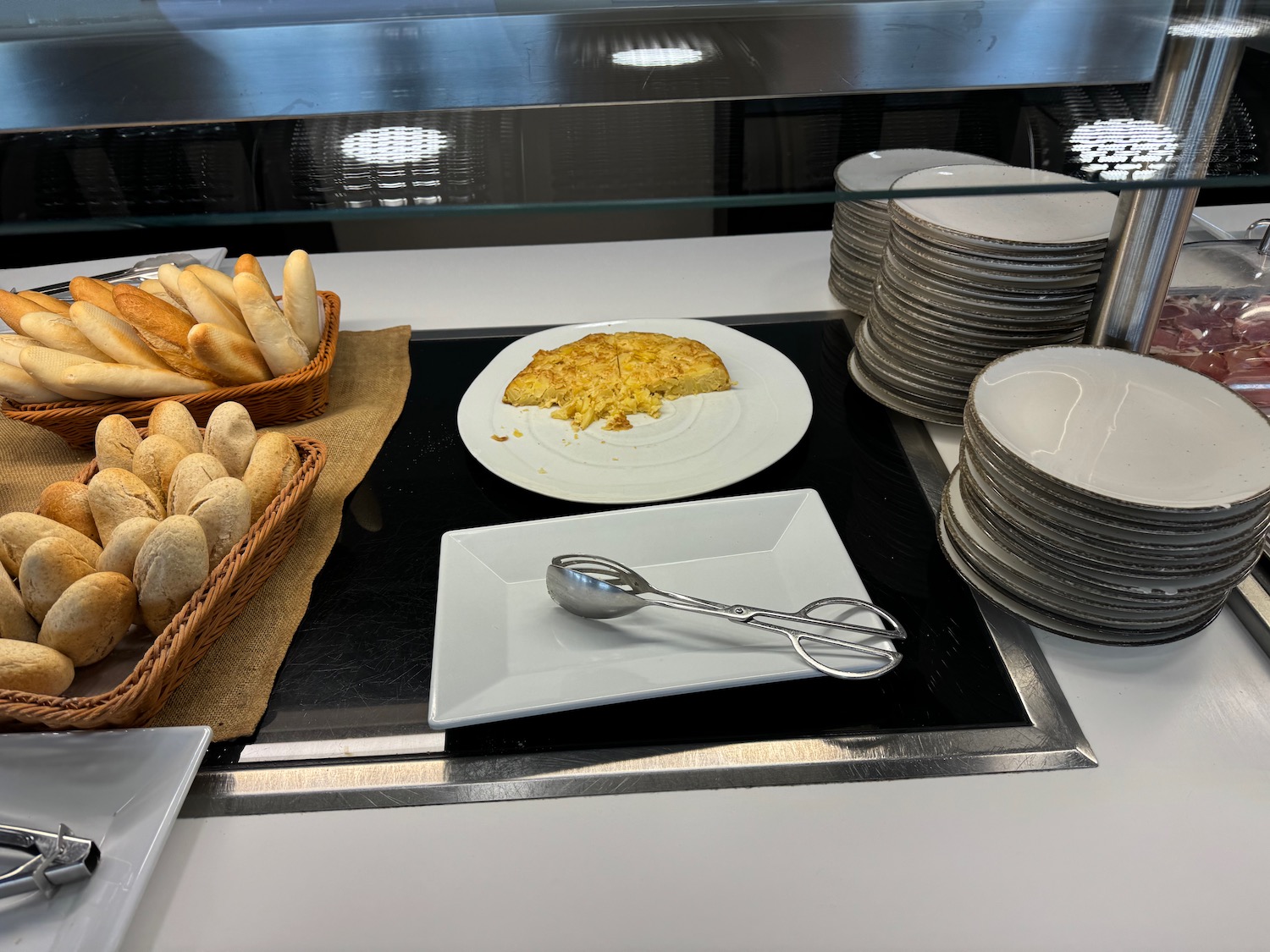 a plate of food and a stack of plates