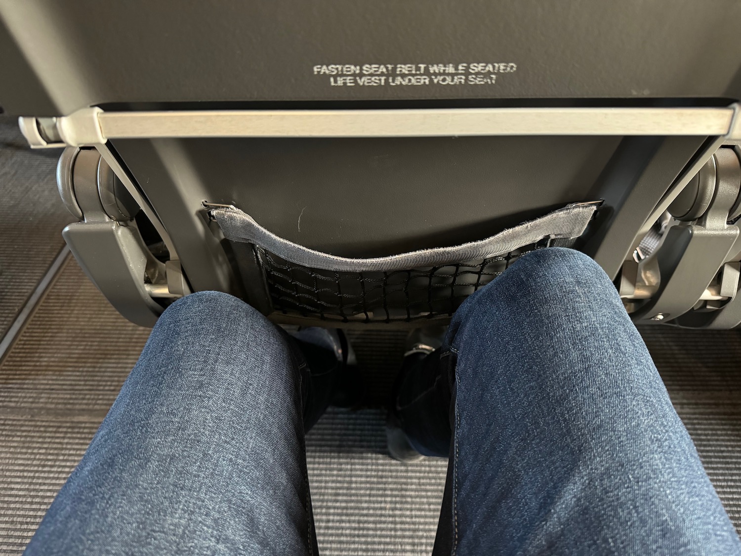 a person's legs in a seat