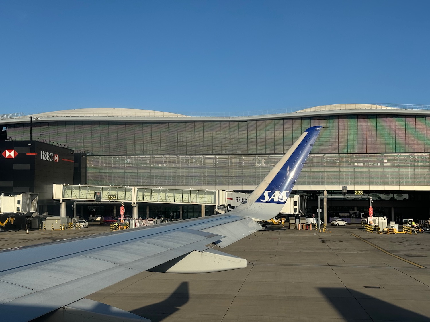 an airplane wing in front of a building