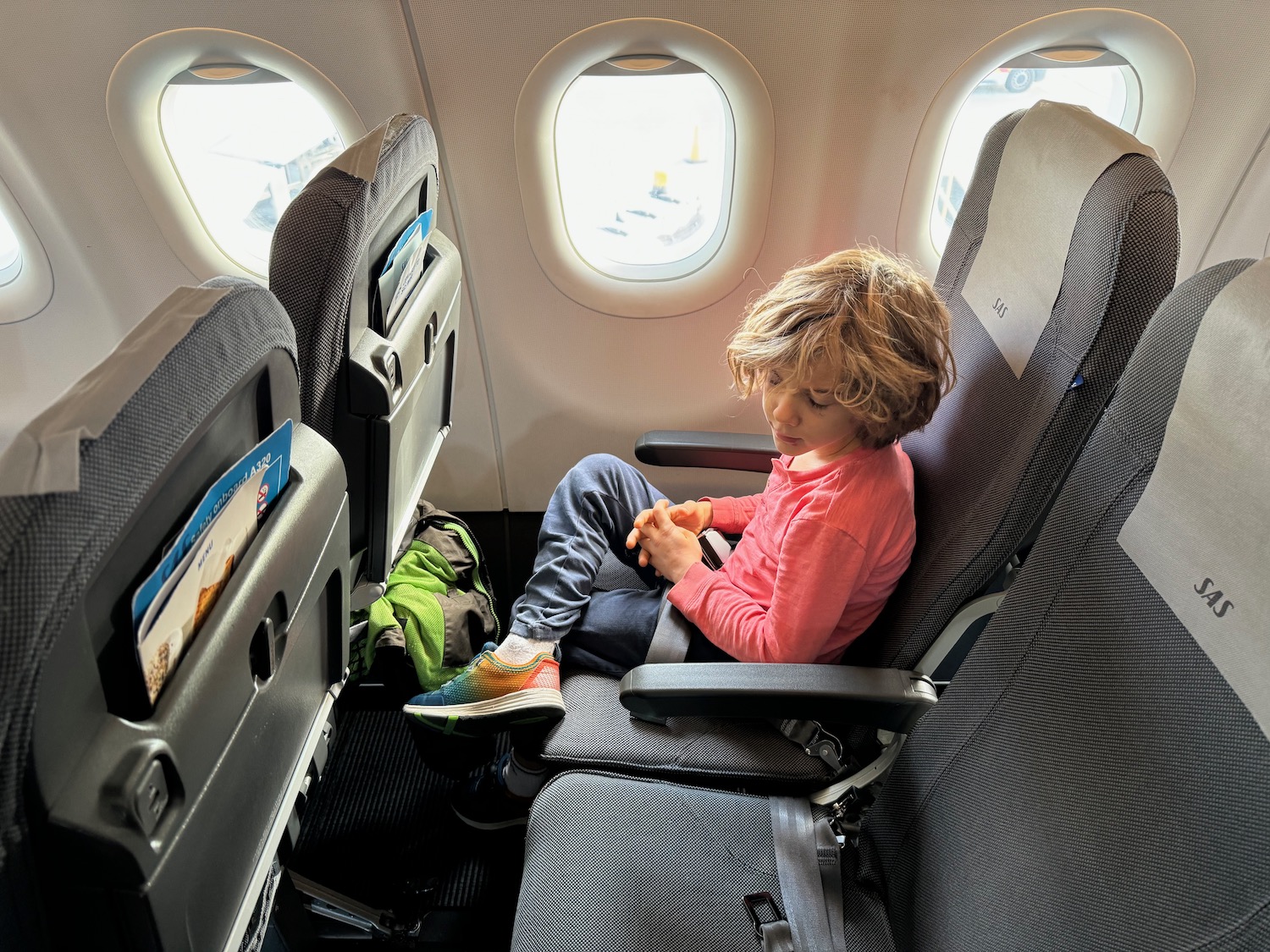 a child sitting in an airplane