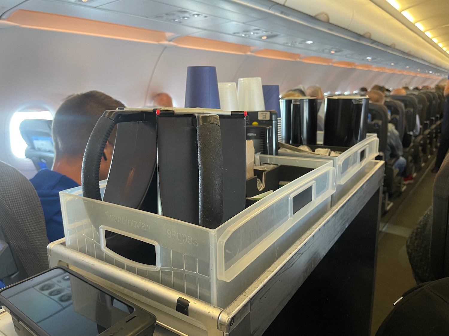 a tray of plastic containers on an airplane