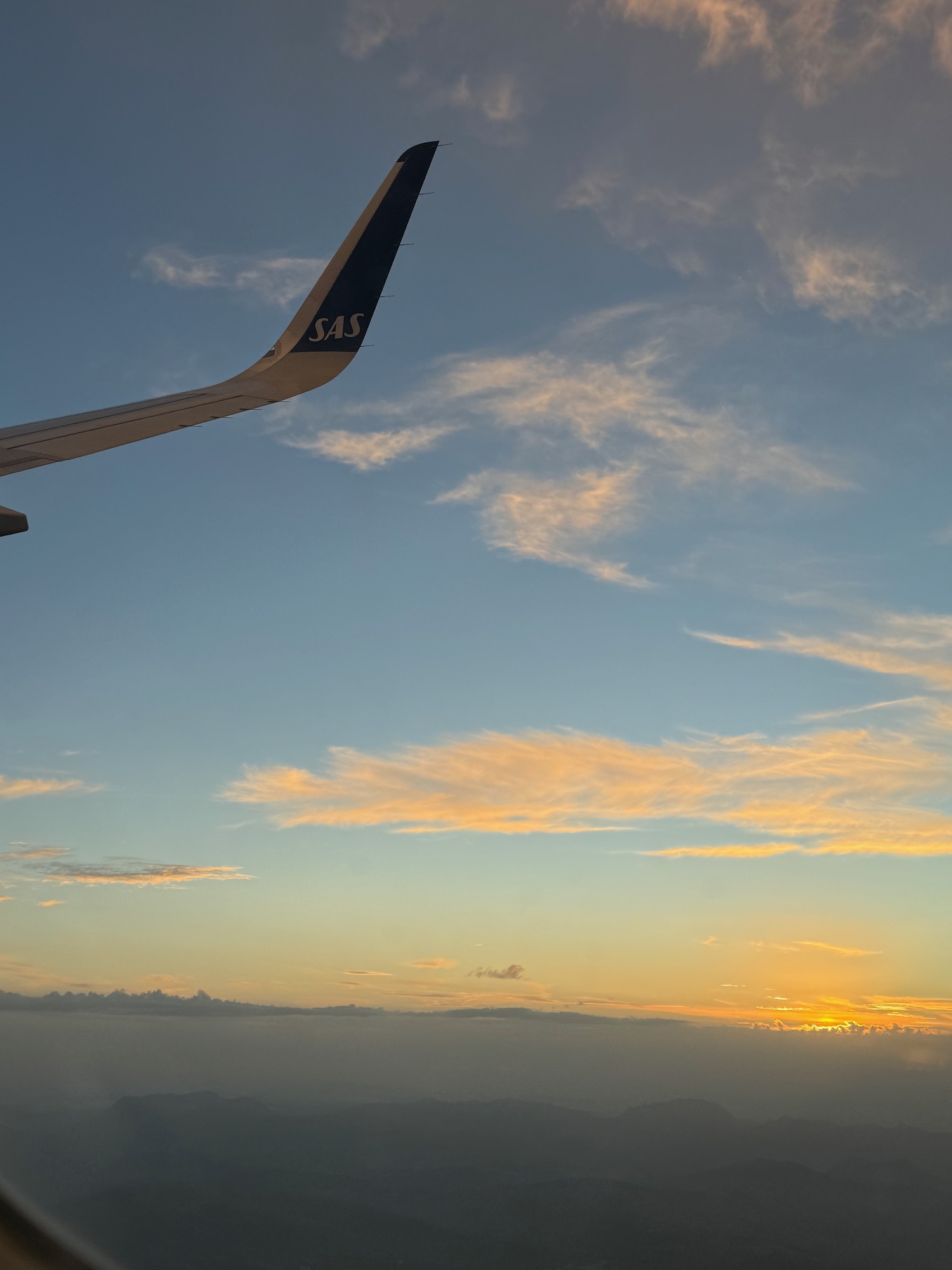 a plane wing in the sky