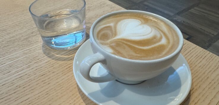 a cup of coffee with a heart design on top of it