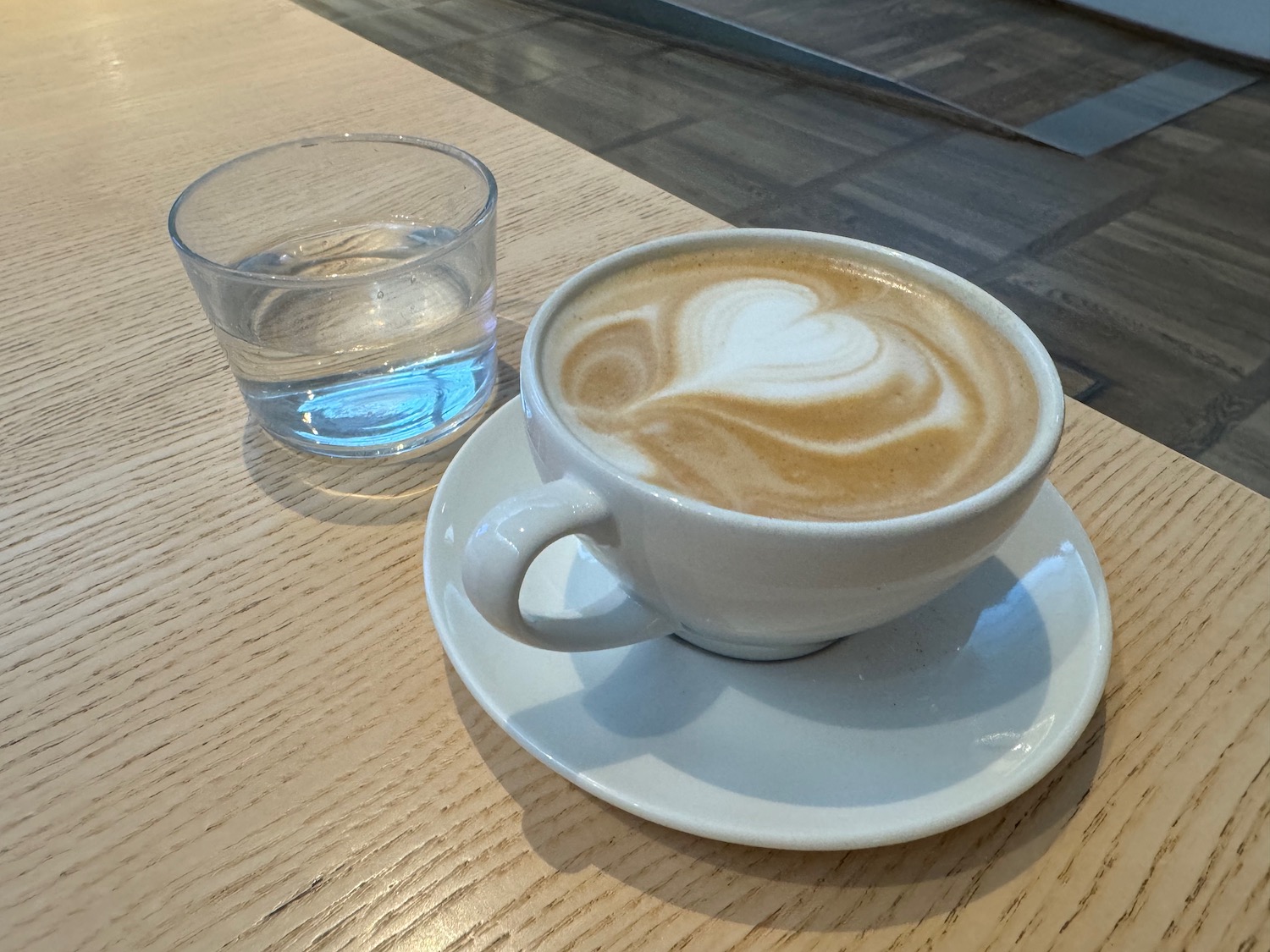 a cup of coffee with a heart design on top of it