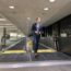 a man standing on an escalator