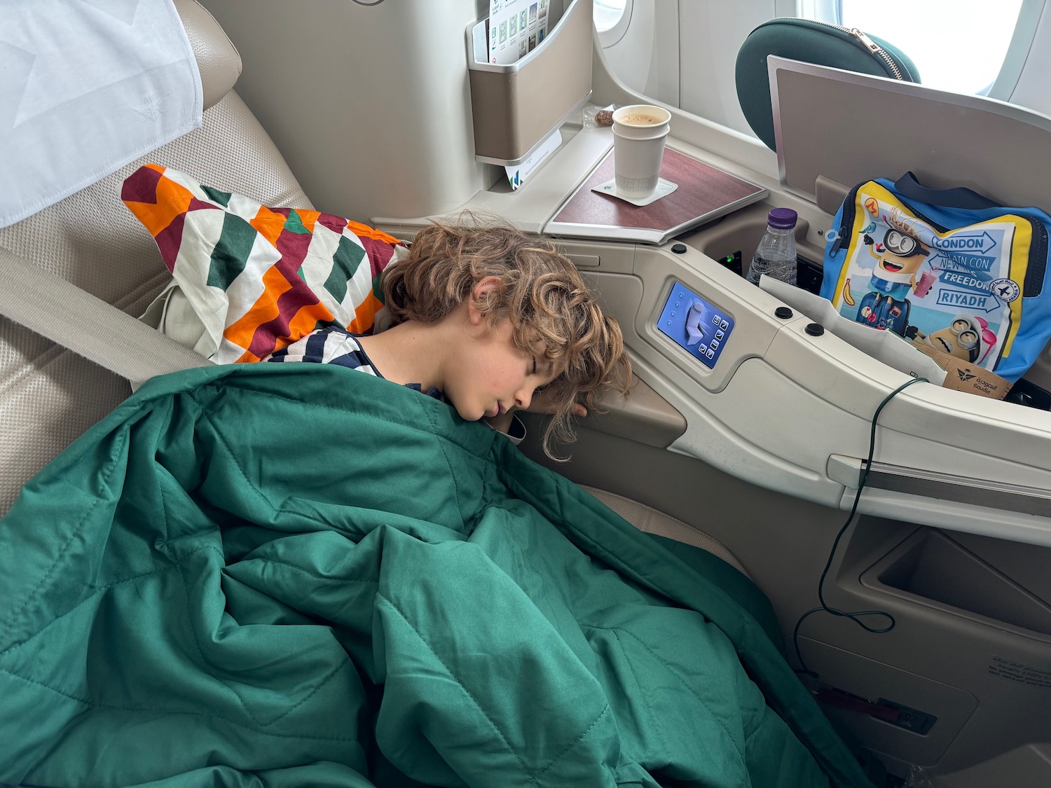 a child sleeping in an airplane