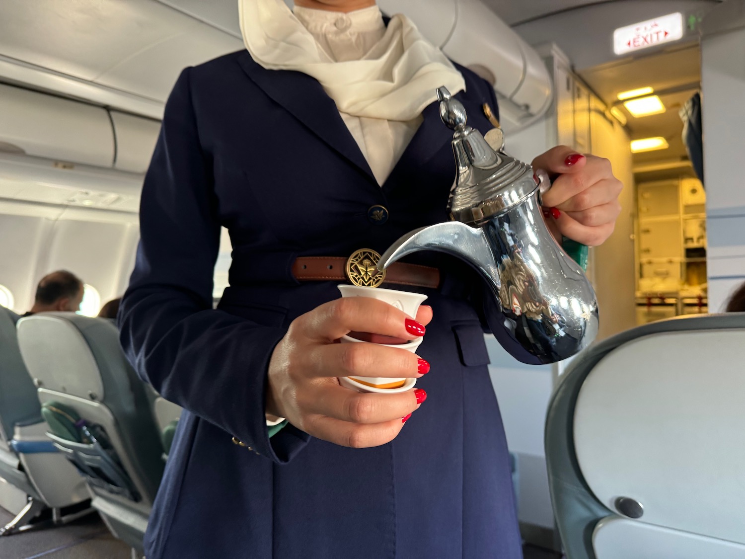 a person pouring a tea from a teapot