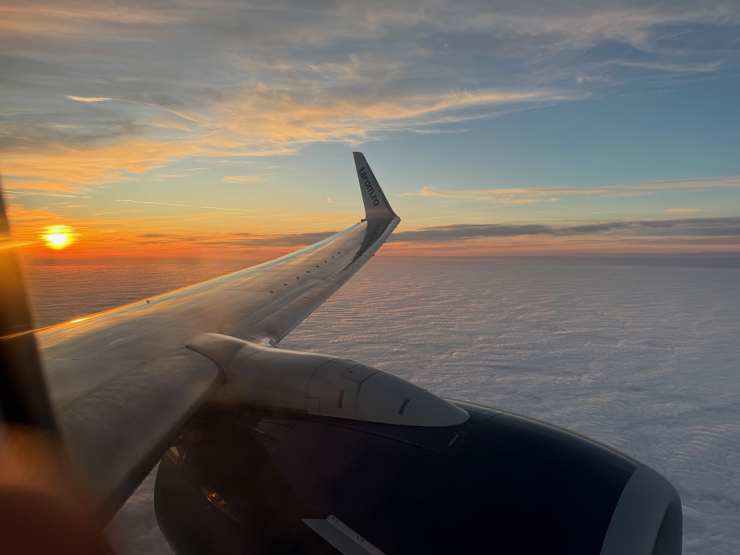 an airplane wing in the sky