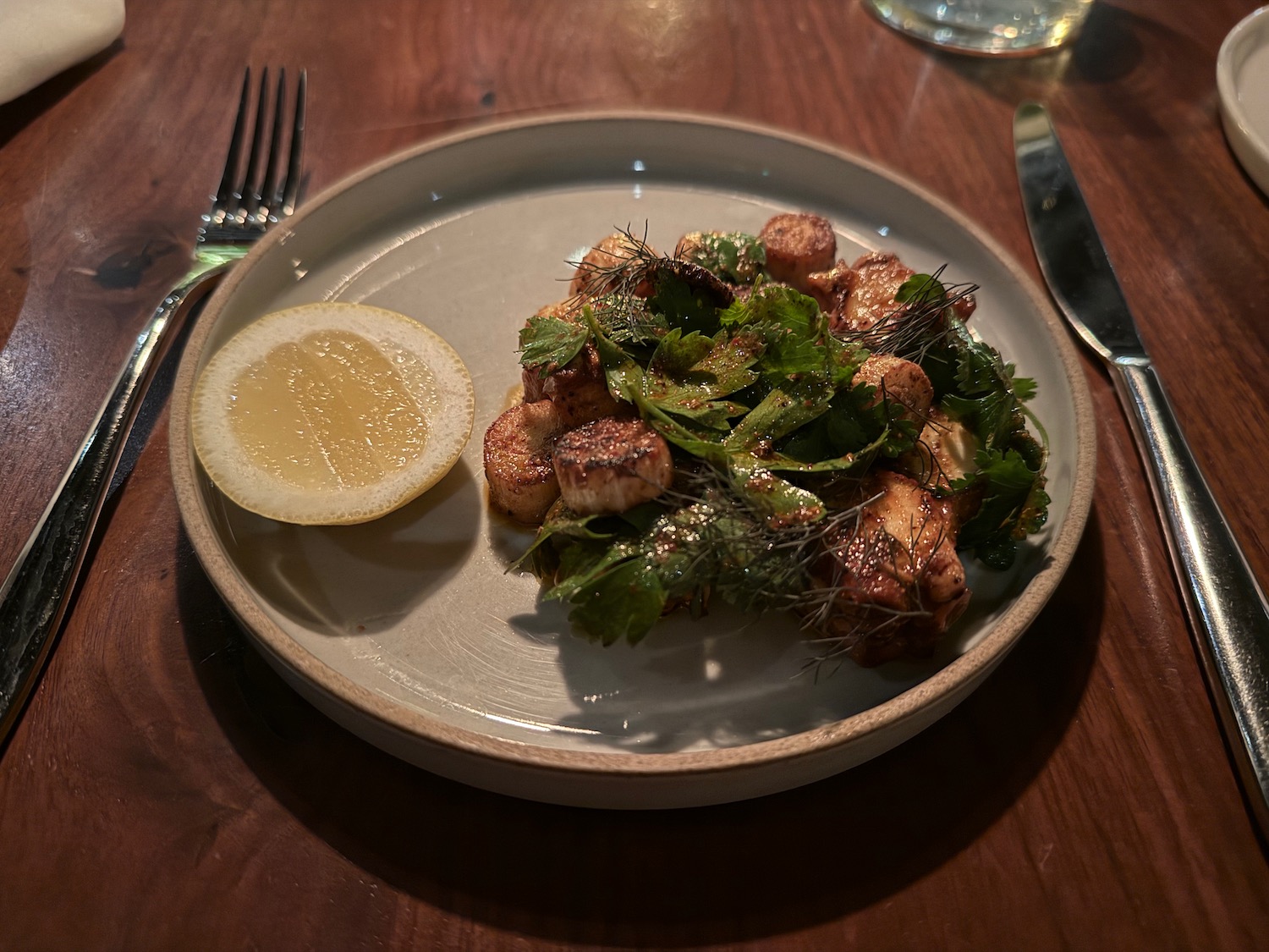 a plate of food with a lemon wedge