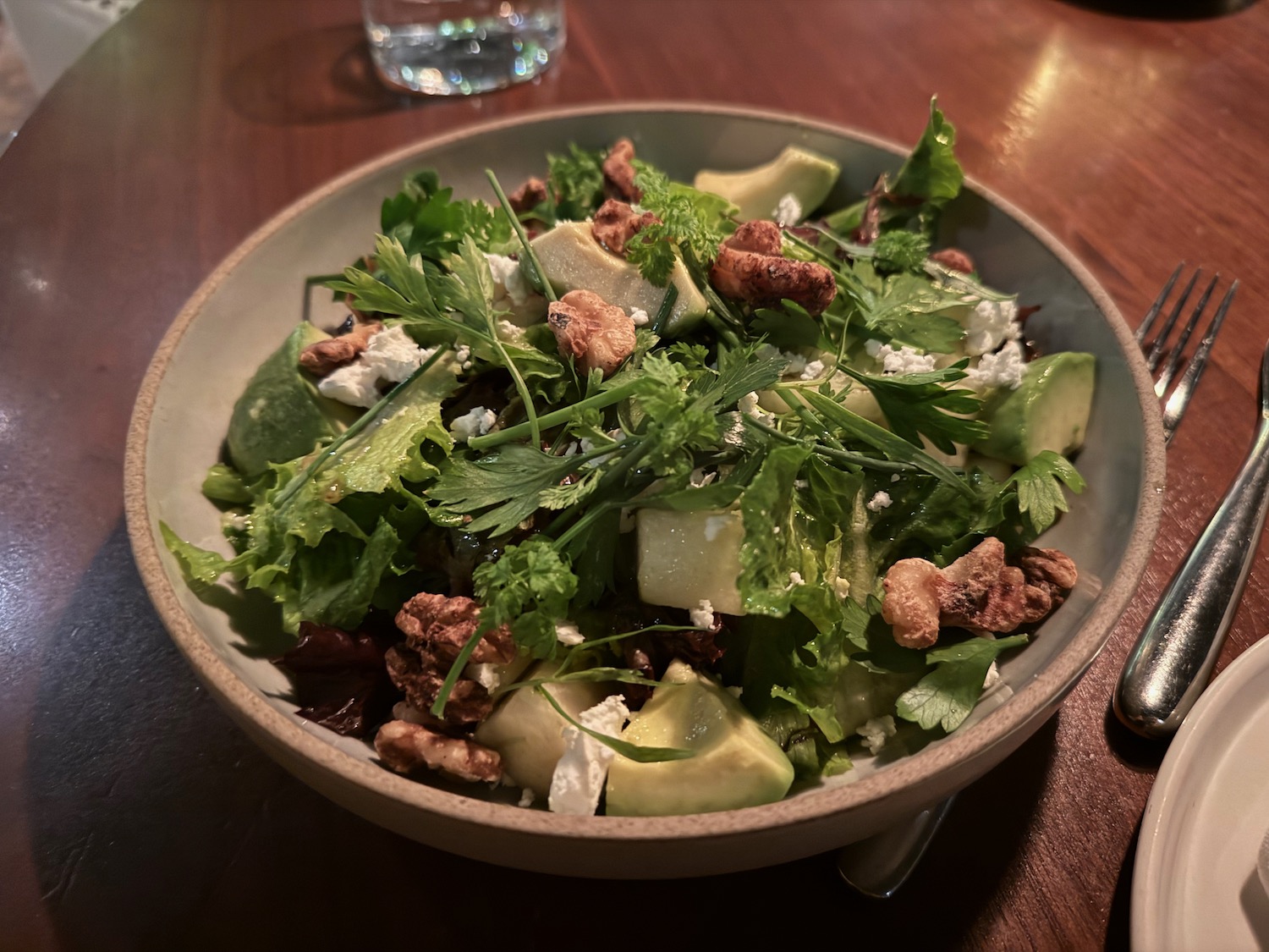 a bowl of salad on a table