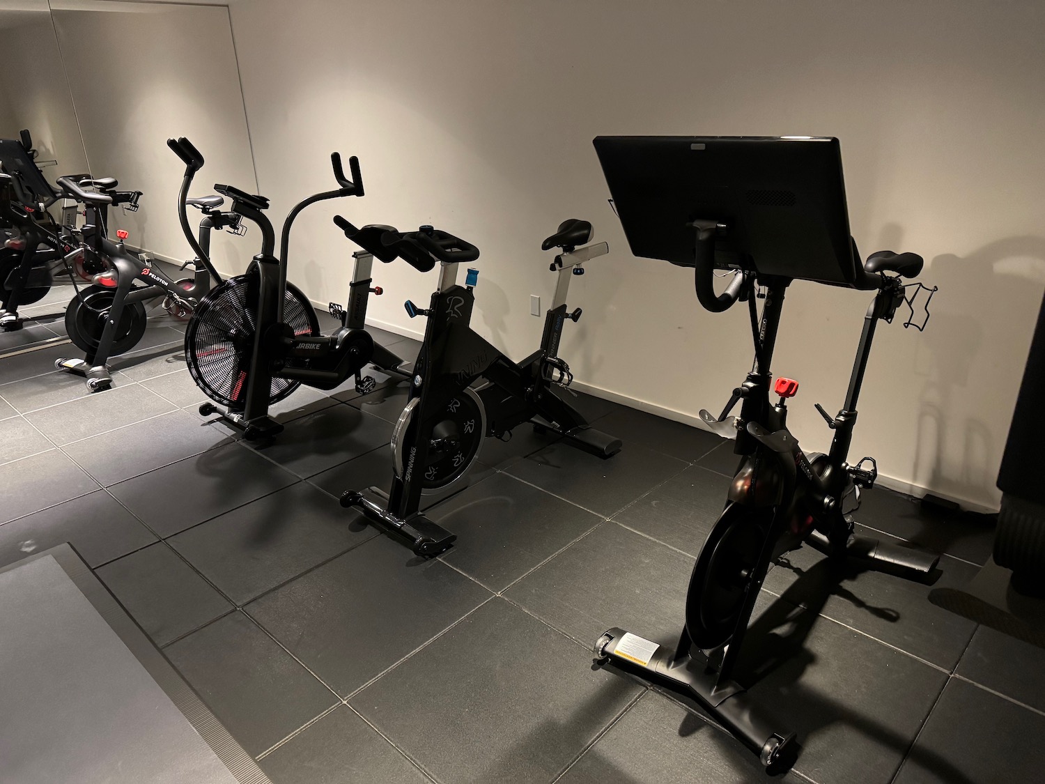 a group of exercise bikes in a room