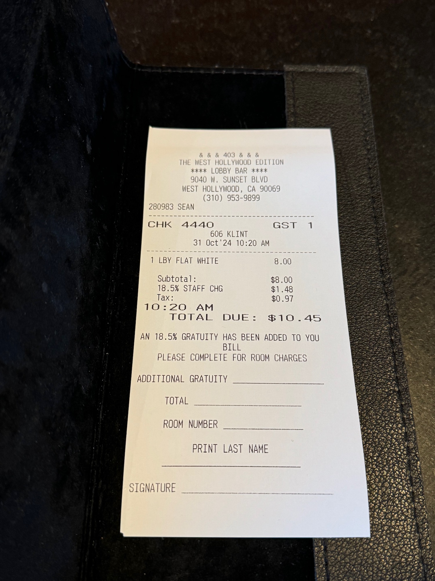 a receipt on a leather wallet