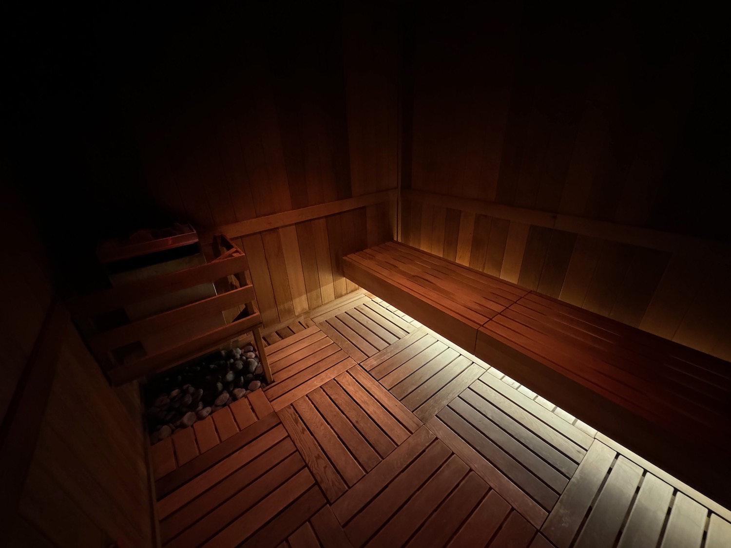 a wooden bench in a dark room