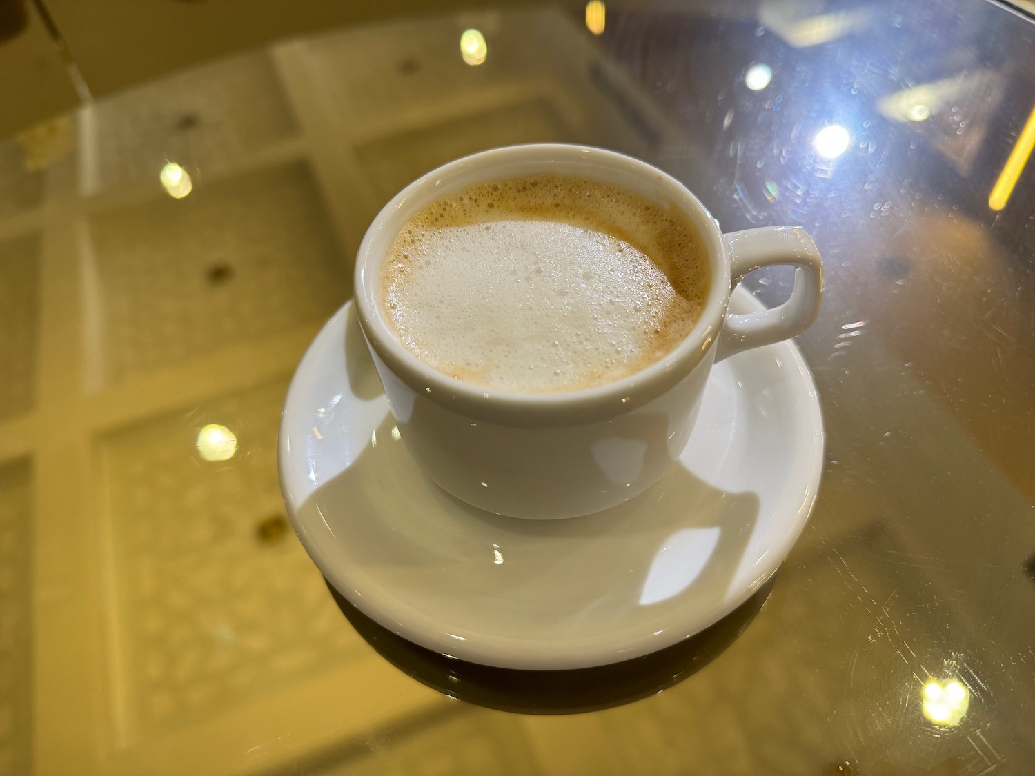 a cup of coffee on a saucer