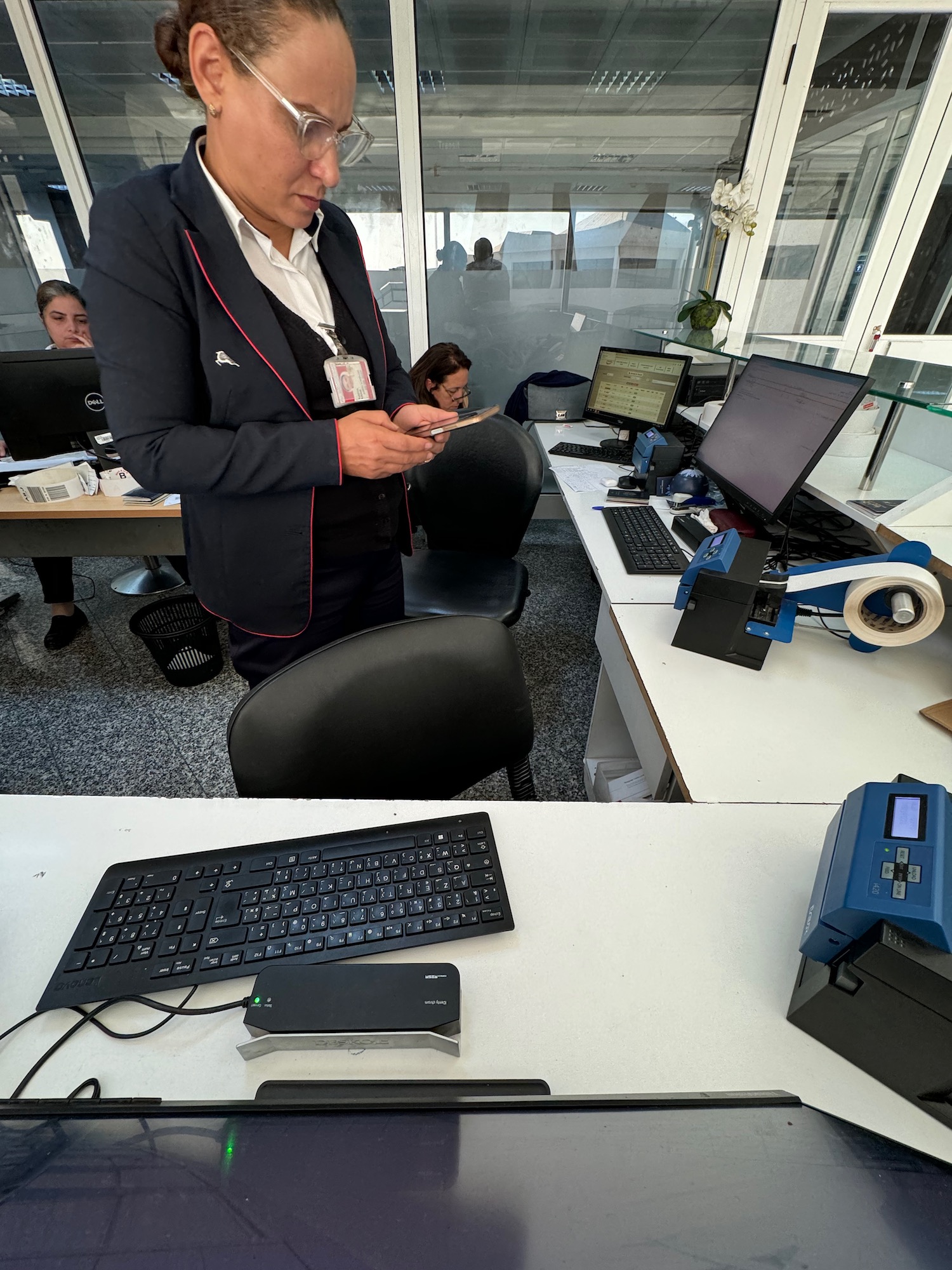 a man standing in front of a computer