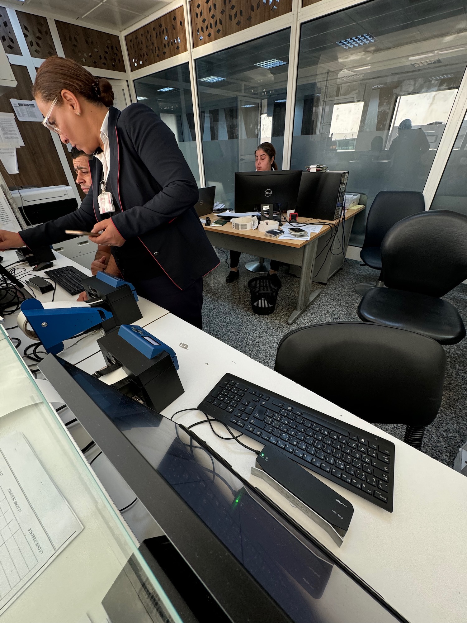 a woman standing in front of a computer