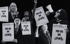 a group of people holding signs