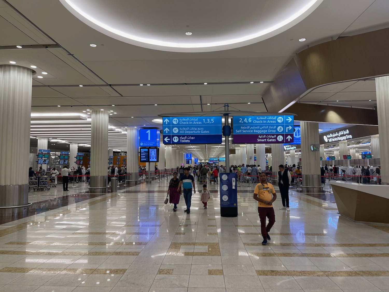 people walking in a large airport