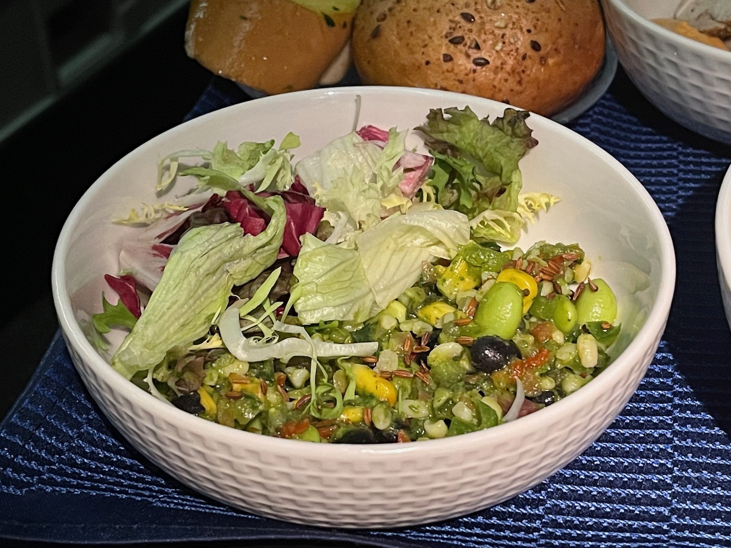 a bowl of salad on a table