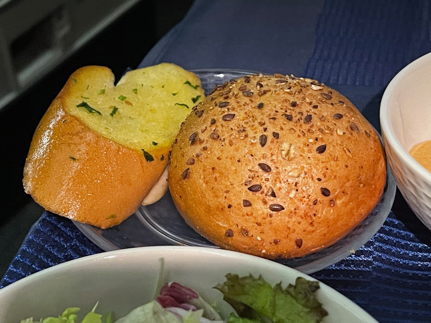 a plate of food and a bowl of salad