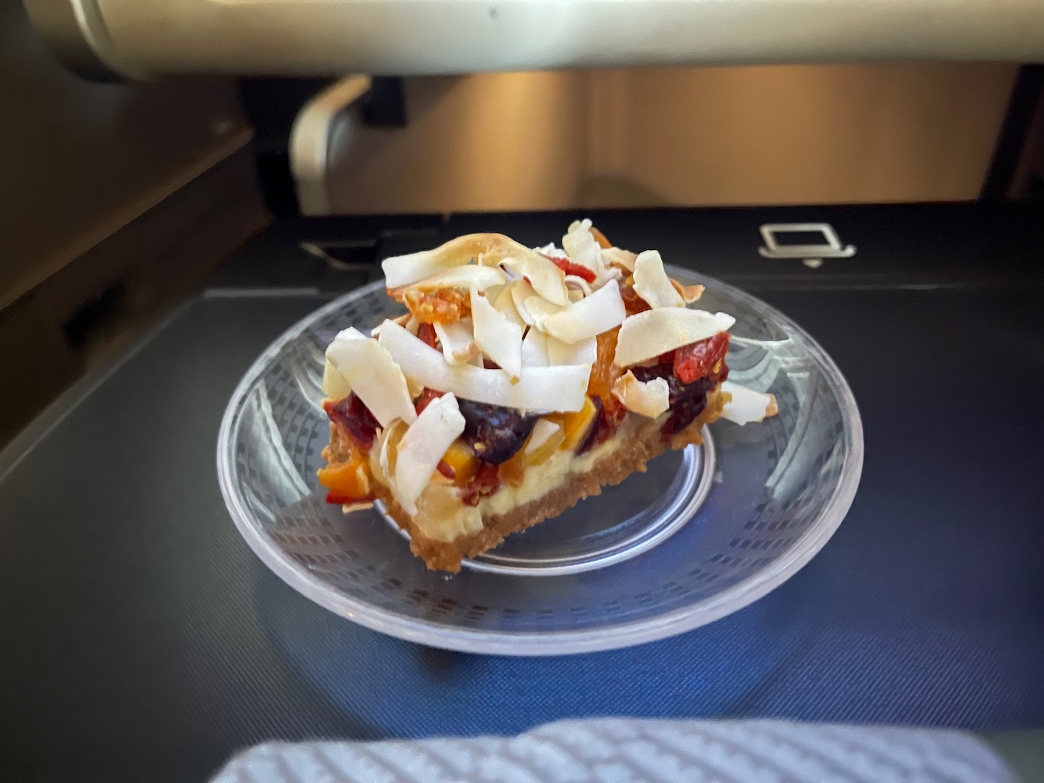 a piece of fruit pie on a clear plate