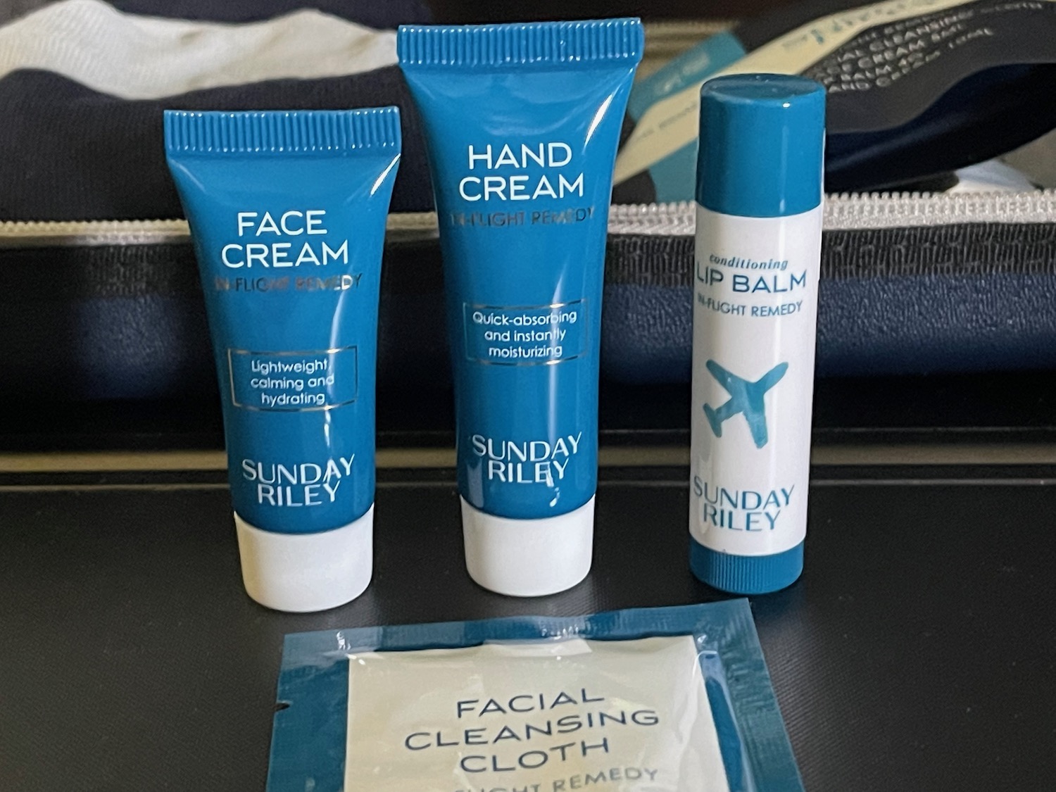 a group of small bottles of facial cleansing products