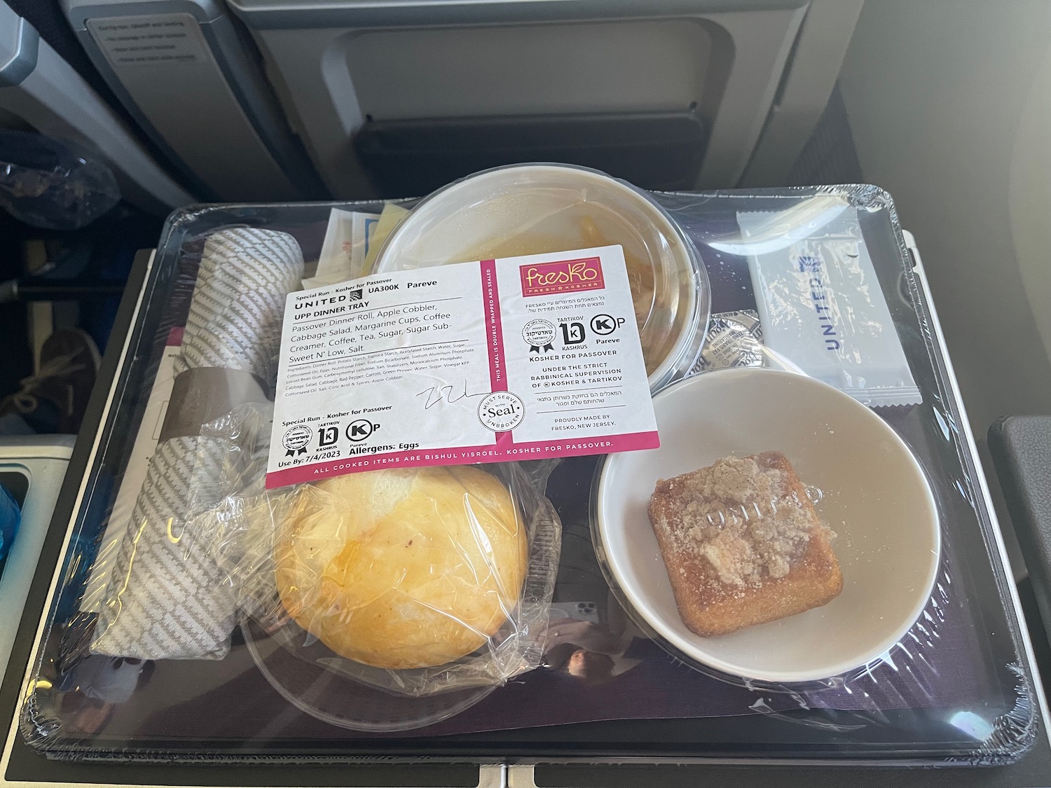 food on a tray on a plane