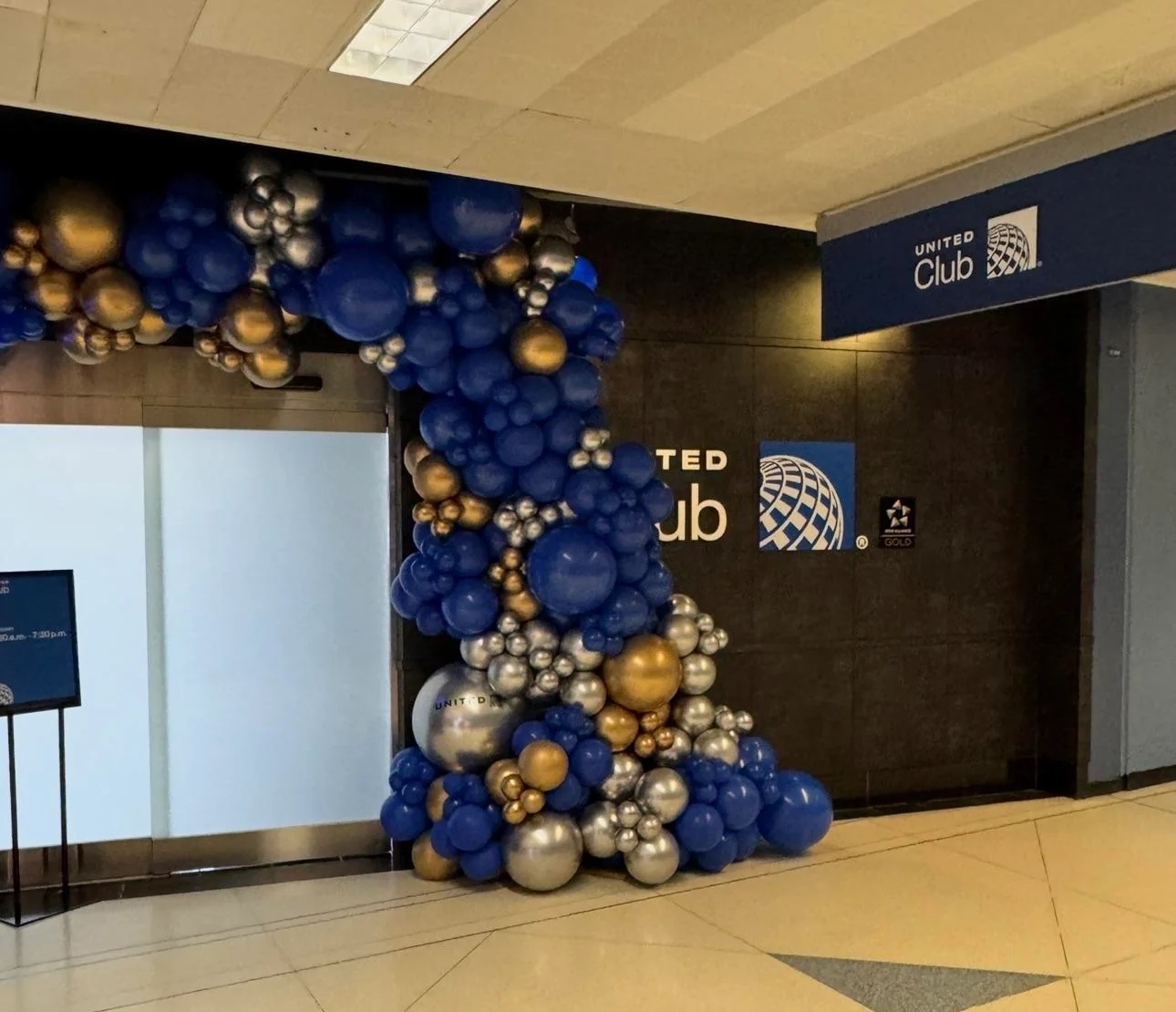 a large group of balloons in a building