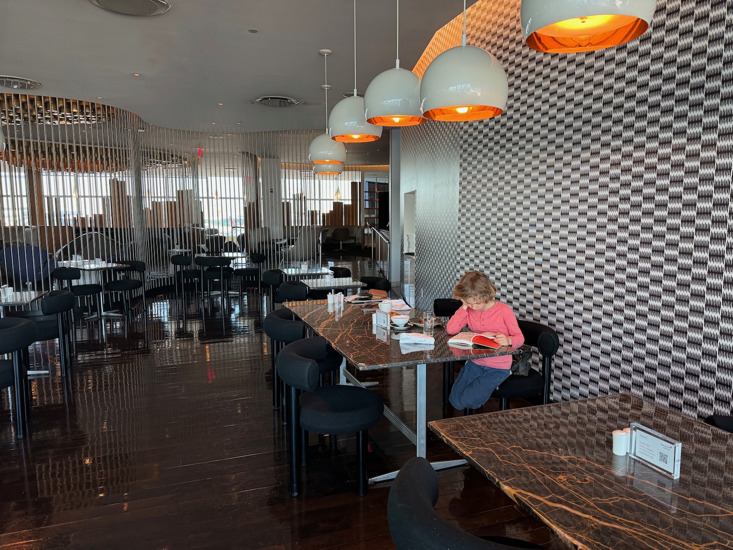 a child sitting at a table in a restaurant