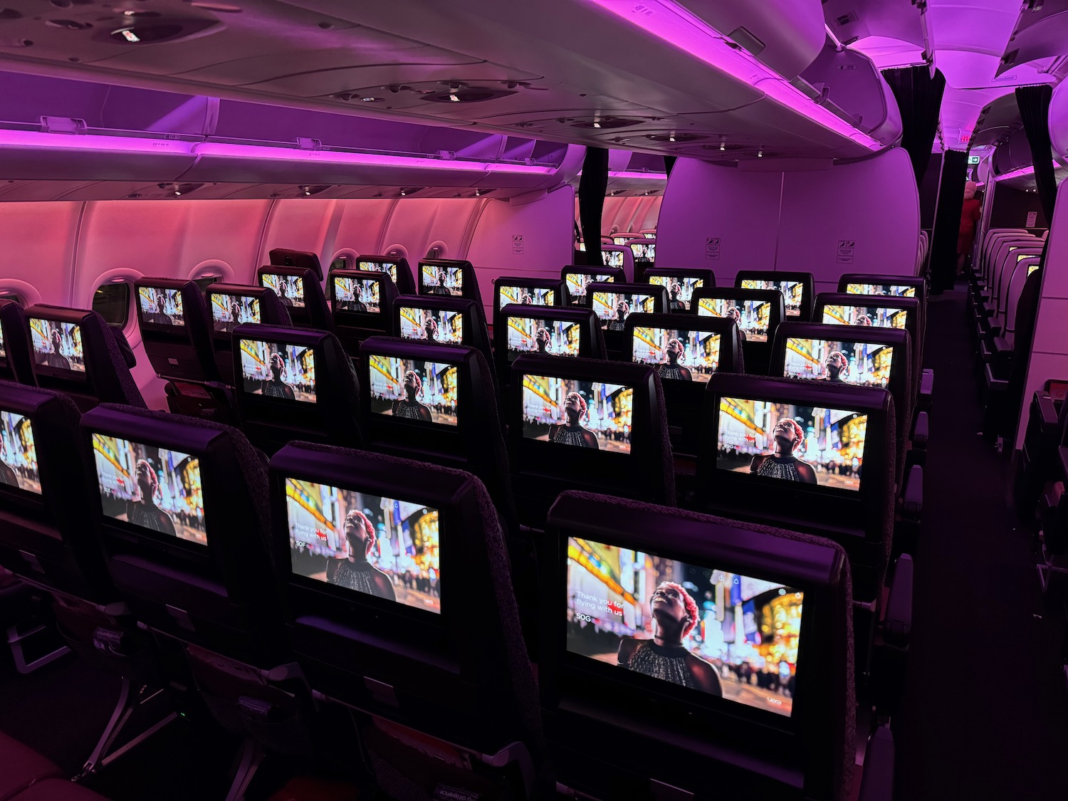 rows of seats with monitors on them