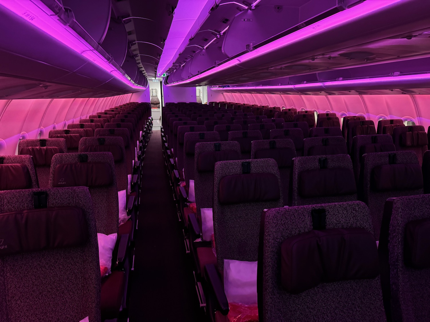 an airplane with purple lights