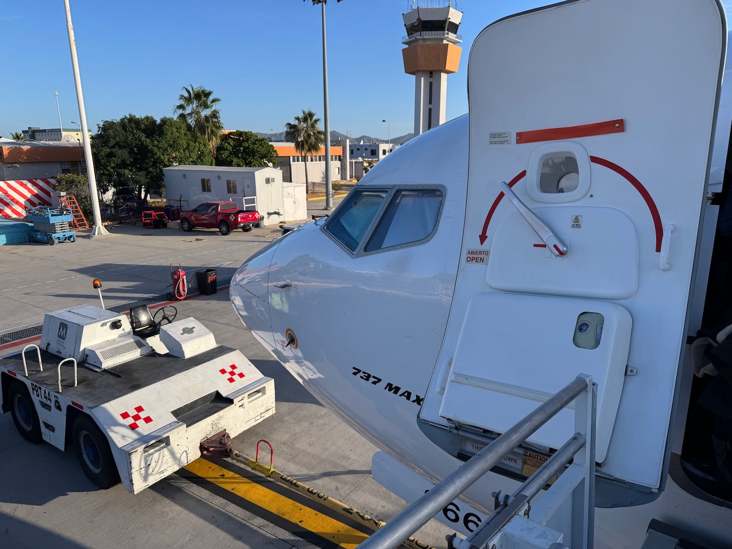 a white airplane parked on a tarmac