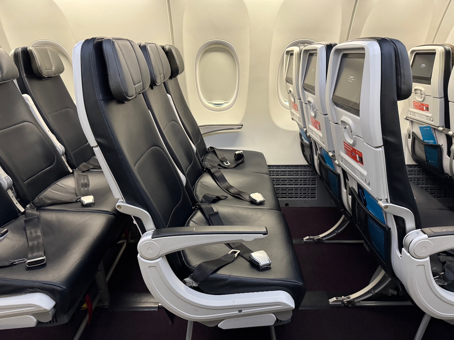 seats in an airplane with seats and windows