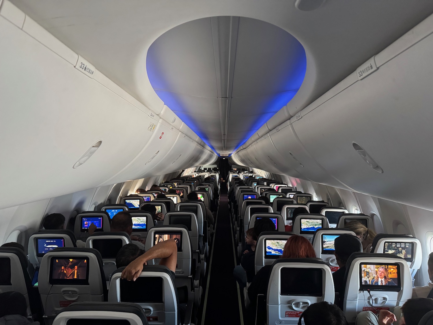 a group of people sitting in an airplane