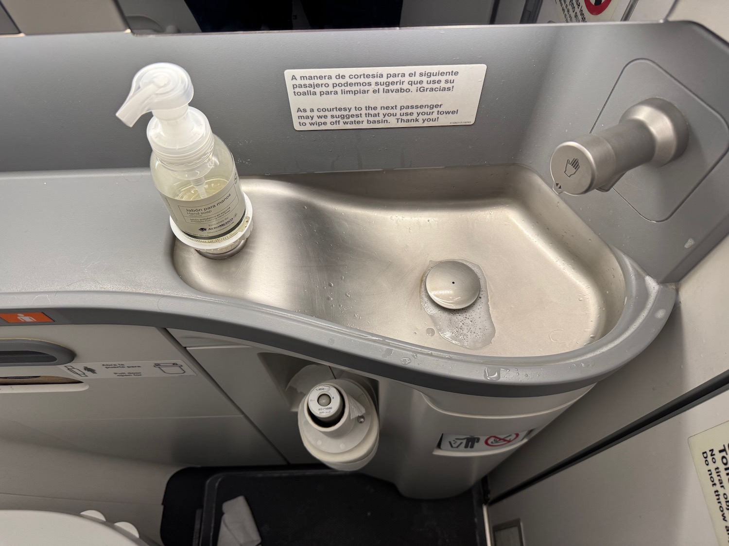 a sink with a soap dispenser on it